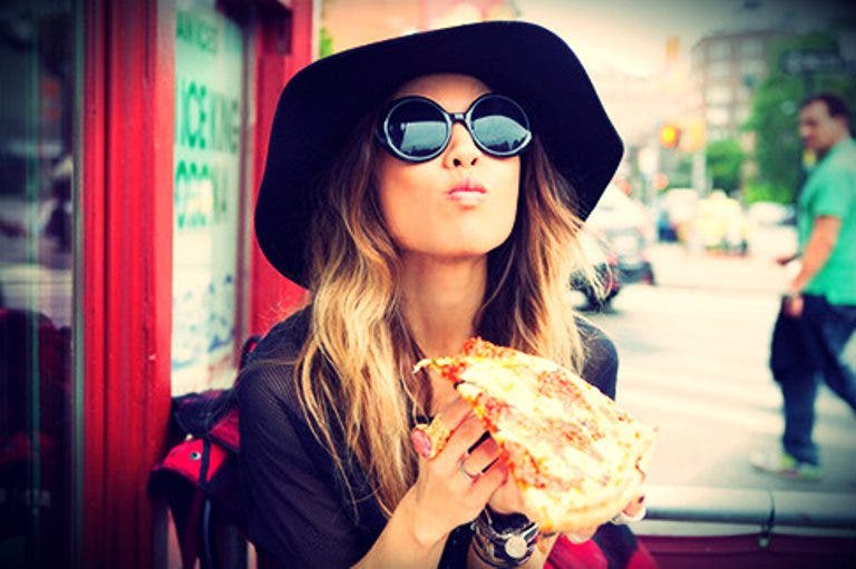 girl eating pizza