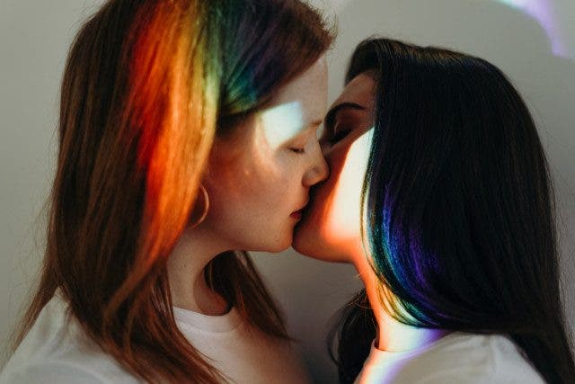 photo of women kissing 3693894